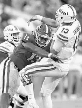  ?? BOB ANDRES/TNS ?? Georgia defensive end Jonathan Ledbetter hits UF quarterbac­k Feleipe Franks as he throws during the Gators’ 36-17 loss to the Bulldogs on Saturday.