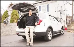  ??  ?? Tim Miranda, a software company manager currently working from home during the coronaviru­s outbreak, sits in his vehicle outside his Chelmsford, Mass, home, Thursday,
April 2, 2020. (AP)