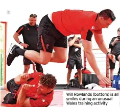  ?? ?? Will Rowlands (bottom) is all smiles during an unusual Wales training activity