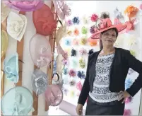  ??  ?? MAD HATTER: Thelma Naidoo, owner of The Royal Hatter in central Durban, shows off one of the fancy hats at the store, which may be suitable for the Durban July next week.
Picture: NIAMH WALSH-VORSTER