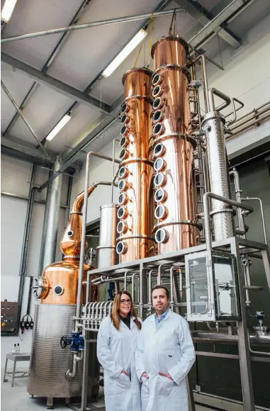  ??  ?? Fiona and David Boyd-Armstrong unveil one of two new state-of-the-art new copper stills at Rademon Estate Distillery in Crossgar, Co Down, as they prepare to launch a whiskey brand