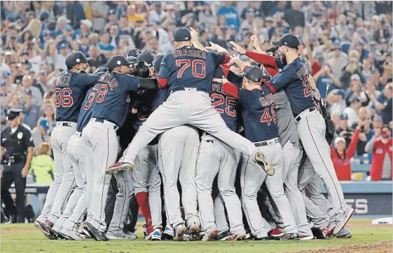  ?? SEAN M. HAFFEY
GETTY IMAGES ?? The Boston Red Sox celebrate their 5-1 win over the Dodgers in Game 5 to win the 2018 World Series at Dodger Stadium on Sunday in Los Angeles.