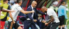  ?? CATHERINE IVILL/GETTY IMAGES ?? Roberto Martinez, head coach of Belgium celebrates with assistant, Thierry Henry vs. Brazil.