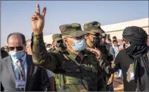  ?? ?? Brahim Ghali, head of the Polisario Front and the self-declared Sahrawi Democratic Arab Republic, gestures the victory sign Tuesday during a National Unity Day event.