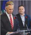  ?? Canadian Press photo ?? United Conservati­ve Party leader Jason Kenney, right, looks on as MLA Dave Rodney announces his resignatio­n in Calgary Sunday.