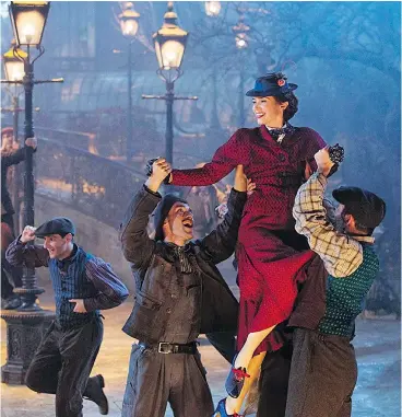  ?? — PHOTOS: DISNEY ?? Lamplighte­rs hoist Emily Blunt in Mary Poppins Returns.