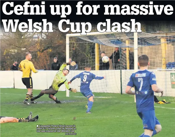  ??  ?? Llangefni Town (blue) score in their 5-1 victory over St Asaph in the last round of the Welsh Cup