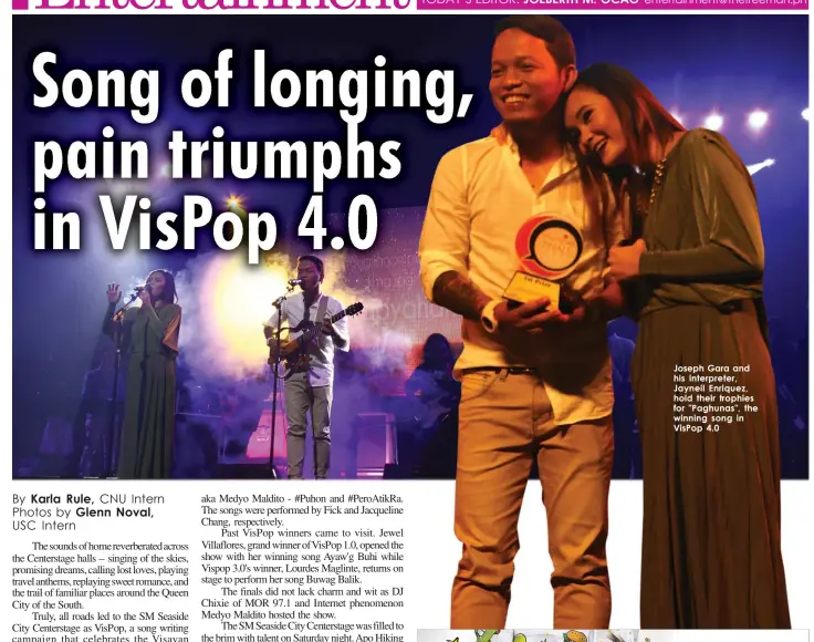  ??  ?? Joseph Gara and his interprete­r, Jayneil Enriquez, hold their trophies for "Paghunas", the winning song in VisPop 4.0