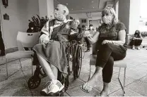  ?? Lynne Sladky / Associated Press ?? Ken Fishman, 81, and Esther Wallach, 82, wait for the vaccine at The Palace assisted living facility Tuesday in Coral Gables, Fla.