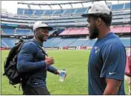  ?? STAFF PHOTO BY MATT STONE/ BOSTON HERALD ?? New England Patriots rookie linebacker­s Christian Sam and Ja’Whaun Bentley pass by each other while speaking to the media at Gillette Stadium on Tuesday, May 15, 2018.