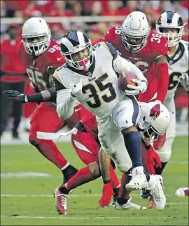  ?? Rick Scuteri Associated Press ?? C.J. ANDERSON signed with the Rams last month and debuted with 167 yards in a win at Arizona. He followed with two more 100-yard games, including last week.
