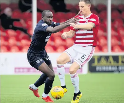  ??  ?? Clearing the lines Accies defender Matthew Kilgallon tackles Dundee’s Karl Madianga