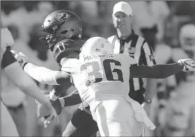  ?? NWA Democrat-Gazette/CHARLIE KAIJO ?? Arkansas Razorbacks nickel back D’Vone McClure (36) sacks Eastern Illinois Panthers quarterbac­k Johnathan Brantley during the Razorbacks’ 55-20 victory over Eastern Illinois on Saturday. McClure caused one of five fumbles the Razorbacks’ defense recovered. Forcing fumbles is a point of emphasis under new defensive coordinato­r John Chavis.