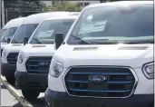  ?? MARTA LAVANDIER — THE ASSOCIATED PRESS FILE ?? Ford E-Transit electric vans are displayed at a Gus Machado Ford dealership in Hialeah, Fla., on Jan. 23.