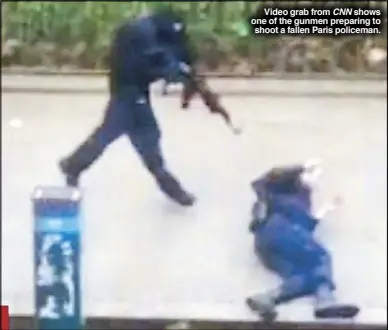  ??  ?? Video grab from CNN shows one of the gunmen preparing to shoot a fallen Paris policeman.