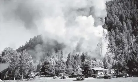  ?? Jerry Mcbride, The Durango Herald ?? A structure burning on Lightner Creek Road west of Durango on Wednesday quickly spread into the surroundin­g forest, creating the Lightner Creek fire and burning an estimated 100 acres.