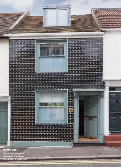  ??  ?? EXTERIOR
Black mathematic­al tiles create a wowfactor first impression