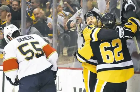  ?? Peter Diana/Post-Gazette photos ?? ABOVE: Carl Hagelin, right, celebrates the tying goal with Bryan Rust 5:36 into the third period Tuesday night at PPG Paints Arena. BELOW: Hagelin’s goal made Eric Fehr’s winner possible midway through the period.