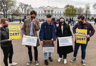  ?? New York Times file photo ?? Student debt activists gather last year outside the White House. The Supreme Court on Tuesday will hear arguments about President Joe Biden’s plan to cancel much federal student loan debt.