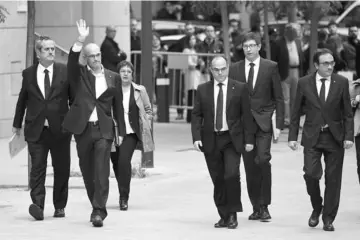  ??  ?? Members of the deposed Catalan regional government (left to right) Joaquim Forn, Raul Romeva, Dolors Bassa, Jordi Turull, Carles Mundo and Josep Rull arrive at the National Court in Madrid to be questioned over their efforts to spearhead Catalonia’s...