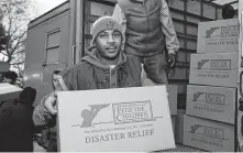  ?? Neilson Barnard / Getty Images ?? Carmelo Anthony took time to distribute aid in 2012 as part of his foundation's Storm Relief Project in New York City.
