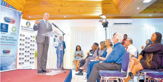  ?? CONTRIBUTE­D ?? Prime Minister Andrew Holness delivers the keynote address at the launch of Haughton’s Pharmacy RxPak® mobile app, at Tropics View Hotel in Hatfield, Manchester, on Thursday, February 29.