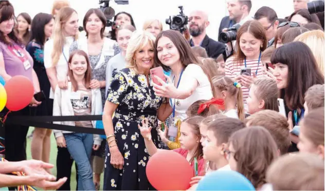  ?? Agence France-presse ?? ↑ Jill Biden poses for a photo during a meeting with Ukrainian teachers and refugees in Bucharest on Saturday.