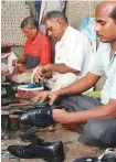  ?? Nilima Pathak/Gulf News ?? Above left: Exterior view of the shoe shop. Above and left: The store’s craftsmen at work.