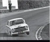  ??  ?? Jim on three Lotus-Cortina wheels in 1965 — a very familiar pose for all Ford race-car fans of the period.