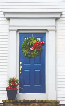  ??  ?? A blue door is subtle but powerful and is perfect for homes with strong lines like bungalows, craftsman-style homes and cottages.