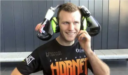  ?? AP Photo ?? CLOWNING AROUND. Boxer Jeff Horn wears a pair of boxing gloves on top of earmuffs Tuesday, December 12, after his weigh-in for his next fight in Brisbane, Australia.