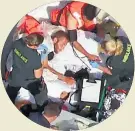  ??  ?? RESCUED Medics treat suspects