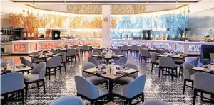  ?? Miami ?? The 16,000-square-foot interior of Gordon Ramsay’s Hell’s Kitchen, which has splashes of red and blue, nods to the colors of the two teams competing for his show’s $250,000 grand prize.