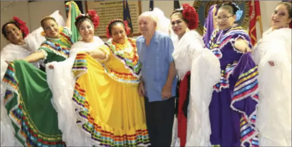  ?? ROLLER PHOTO ?? Marion Journey (center) with dancers of Las Flores Del Valle at the American Legion Post 60 in Brawley, to celebrate his 86th birthday, Wednesday. WILLIAM