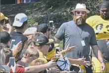  ?? Peter Diana/Post-Gazette ?? Former Steelers lineman Brett Keisel, right, a perennial fan favorite, made an appearance at camp Wednesday.