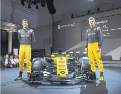  ?? AFP ?? Renault’s Jolyon Palmer, left, and Nico Hulkenberg with the new RS17.