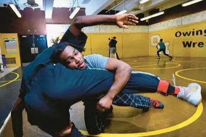  ?? KENNETH K. LAM/BALTIMORE SUN ?? Owings Mills senior wrestler Amondre Wooden practices with teammate Cregg Ngounou on Thursday. Wooden takes a 37-1 mark into the state tournament with Baltimore County and 2A/1A North Region titles on his resume.