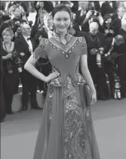 ?? PROVIDED TO CHINA DAILY ?? Deng Chaoyu clad in an embroidere­d gown on the red carpet of the Cannes film festival in May.