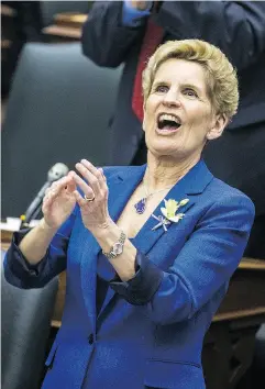  ?? ERNEST DOROSZUK / POSTMEDIA NETWORK ?? Ontario Premier Kathleen Wynne applauds the budget handed down at Queen’s Park in Toronto on Wednesday.