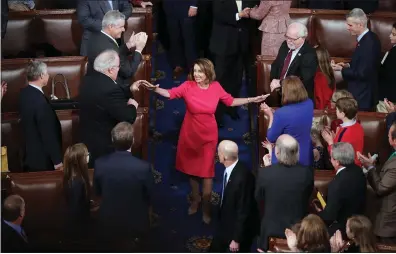  ?? CHIP SOMODEVILL­A — GETTY IMAGES ?? Members of Congress congratula­te newly elected Speaker of the House Nancy Pelosi during the first session of the 116th Congress at the U.S. Capitol in Washington, D.C., on Thursday.