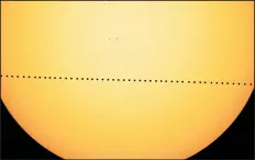  ?? NASA’S GODDARD SPACE FLIGHT CENTER ?? In a composite image provided by NASA, the planet Mercury will cut a diagonal path left to right across the sun.