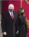  ?? KEVIN DIETSCH Pool photo via AP ?? Vice President Mike Pence and second lady Karen Pence arrive for the inaugurati­on of Joe Biden.