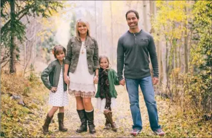  ?? Courtesy photo ?? The Ronchettis, still looking happy despite the challenges of building a high-elevation house. Their adventure in home building will be chronicled in a series, “Mark vs. the Mountain,” on FOX New Mexico and online at KRQE.