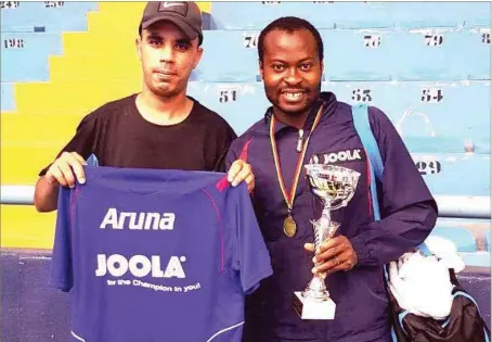  ??  ?? Aruna Quadri (right) shortly after defeating Omar Assar of Egypt at the ITTF African Cup in Morocco... yesterday