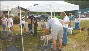  ?? / Staff ?? Many gathered at the Pets R Us/Animal Rescue League of Northwest Georgia Adoption Event to show support for the cause. Guests arrived as early as 9:30 a.m. in anticipati­on for the event to start.