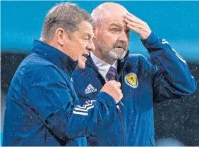  ??  ?? John Carver discusses tactics with Steve Clarke at Wembley