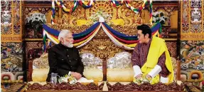  ?? Photo: AFP ?? Narendra Modi meets King Jigme Khesar Namgyel Wangchuck at the Tashichho Dzong Palace in the Bhutanese capital Thimphu. Modi is the first Indian prime minister to be hosted at the palace.