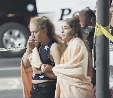  ?? PICTURE: AP. ?? AFTERMATH: Distraught people at the scene outside the bar, where the gunman opened fire, in Thousand Oaks, California