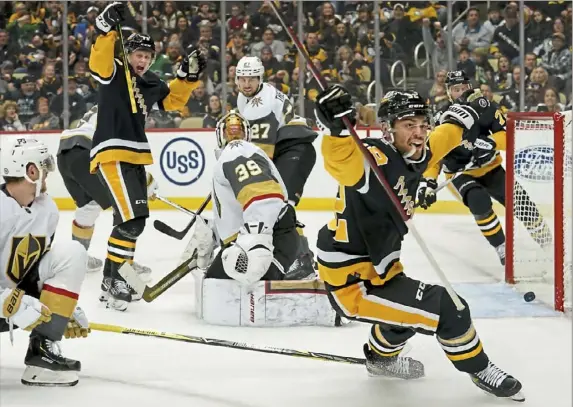  ?? Matt Freed/Post-Gazette ?? Penguins defenseman Mark Friedman celebrates after scoring the go-ahead goal early in the third period Friday night at PPG Paints Arena.