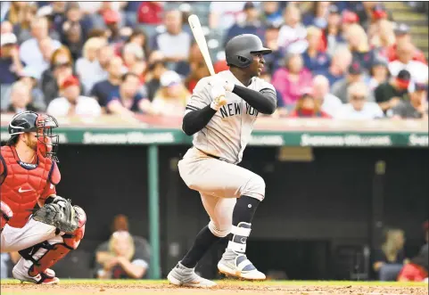 ?? Jason Miller / Getty Images ?? The Yankees’ Didi Gregorius hits a single during the fourth inning at Cleveland on Friday. Gregorius went 2-for-4 in his return from offseason elbow surgery. The Indians won 5-2.